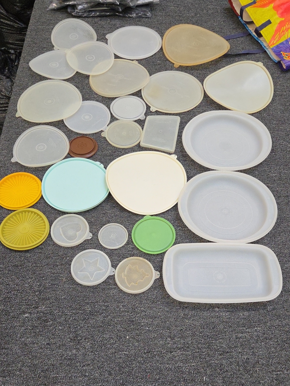 26 Tupperware Assorted Plastic Lids in White, Cream, Yellow, Green, Blue, Brown
